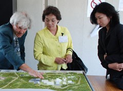 Jean-Michel Bottereau (left, Agence Iter France) explains the ITER site layout to Ms. Kusumi (middle) and Ms. Ishikawa (right).