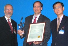 Winner of the inaugural Nuclear Fusion Award, Dr Timothy C. Luce (General Atomics), is presented with his award by Professor Werner Burkart (Deputy Director General, International Atomic Energy Agency) and Dr Mitsuru Kikuchi (Chairman of the Board of Editors, Nuclear Fusion and Director Division of Advanced Plasma Research, Japan Atomic Energy Agency) at the 21st IAEA fusion conference.

