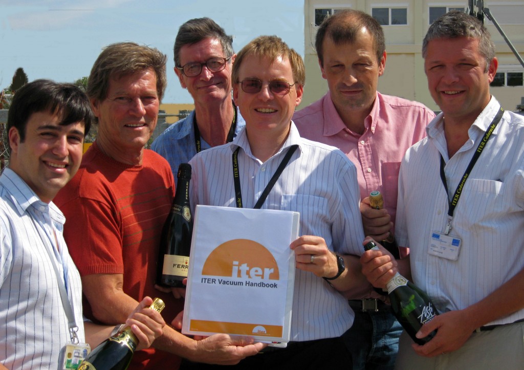 Pumping it up... the ITER Vacuum Group poses with the new handbook