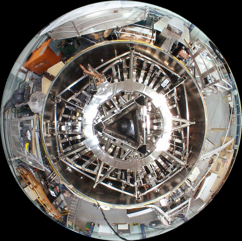 Fisheye view of H-1 from above. H-1 is the National Plasma Fusion Research Facility located at the Australian National University's Research School of Physics and Engineering. H-1 is a 3-period heliac type of stellarator (i.e., one with a helical magnetic axis) with a major radius of 1 m and a mean minor radius in the range 0.15 - 0.2 m. Its design makes it a highly flexible experimental apparatus.