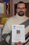 Nuno Bràs Henriques holding his Master's thesis on ITER.