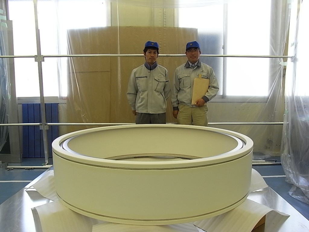 Takashi Inoue (Japan Atomic Energy Agency, JAEA) and Masanobu Tanaka (ITER) proudly present a prototype of the ceramic bushing ring for the ITER neutral beam heating system.