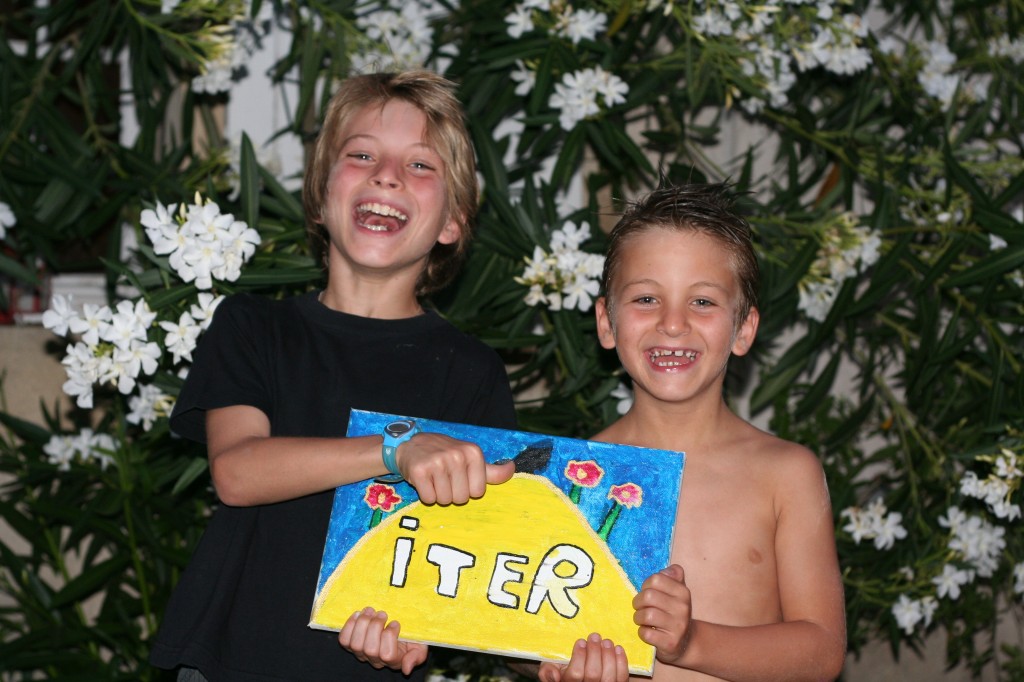 Arthur (left) with his brother Tom showing their interpretation of the ITER logo.