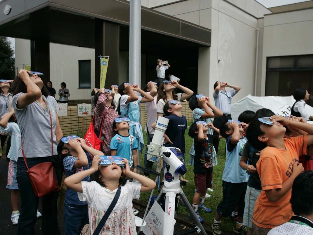 A big event for the small: spectators watching the solar eclipse at Naka.