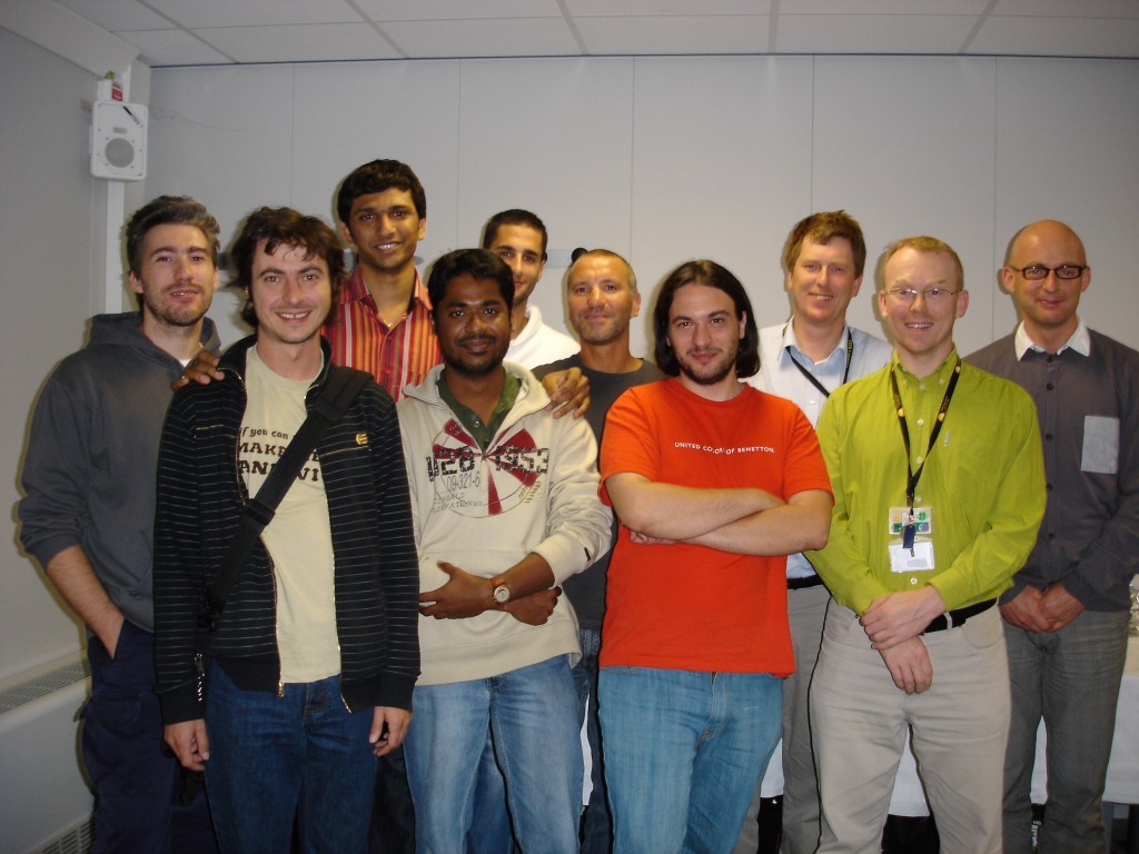 The team that makes the "black box" ICP work together with their one-millionth "customer" Barry Prescott (in green on right).  (Click to view larger version...)