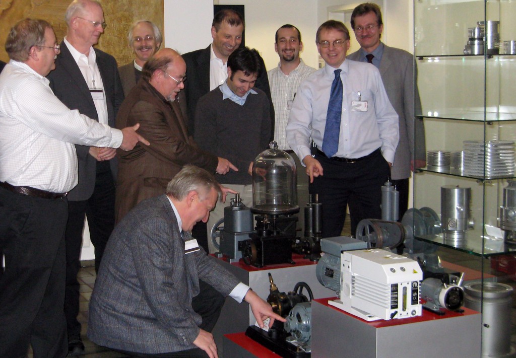 The picture shows members of the ITER Organization and ITER US vacuum teams together with the Oerlikon Leybold Vacuum research team looking at past (antique) roughing pumps in the Leybold Museum of Vacuum.
