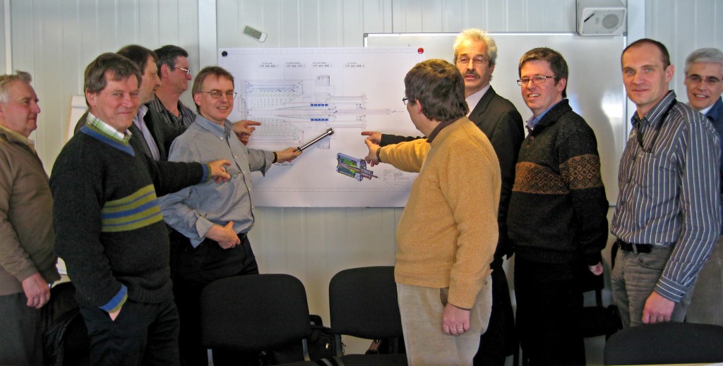 The ITER Vacuum Group and their colleagues from Barcelona  discussing the ITER pre-production cryopump. (Click to view larger version...)